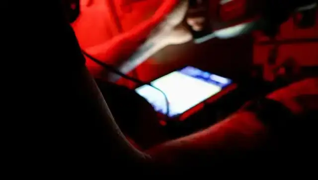 Pilot in the cockpit flying under instrument flight rules at night