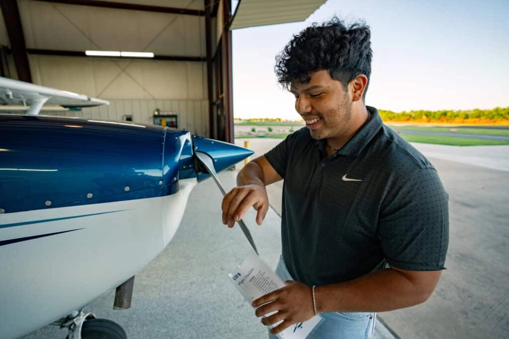 Student and instructor reviewing training materiacl together