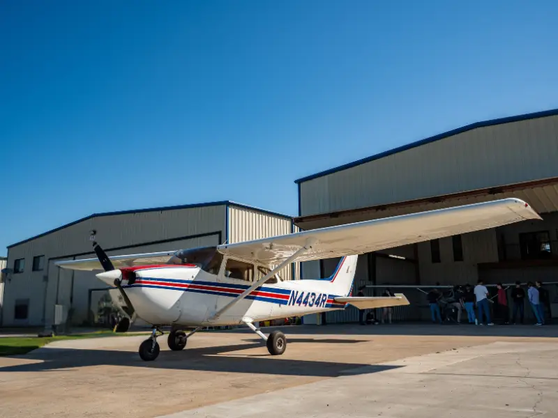 Cessna 172 Skyhawk flying over a beautiful lake in North Texas